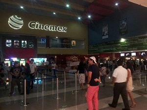 People waiting in line a the concessions counters at a Cinemex Movie Theater in Saltillo, Mexico