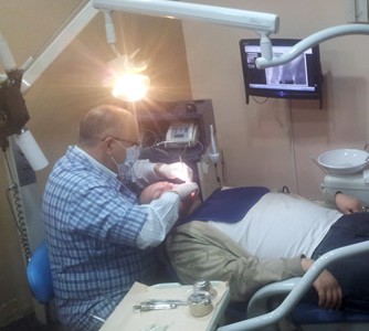 Al Barrus laying in Dentist's chair in Mexico