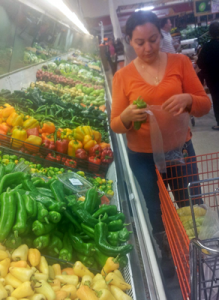 Woman shopping in Mexican grocery store © Al Barrus