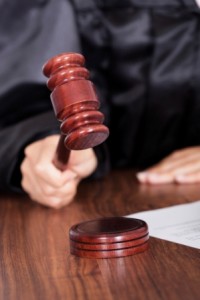 Judge Striking The Gavel In A Courtroom