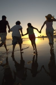 Family running on the beach in Rocky Point, Mexico