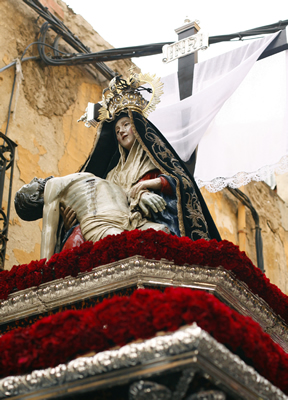 Holy week parade float with Virgin Mary holding Jesus