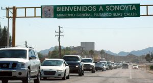 Bienvenidos Sonoyta sign with cars