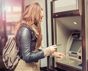 Woman using ATM Machine in Mexico