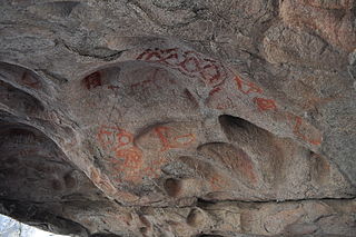 Mural de pinturas rupestres en vallecitos