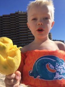 Eating Mango on Mexican beach