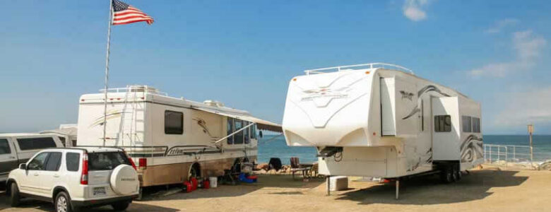 Two RVs parked on the beach in Rocky Point