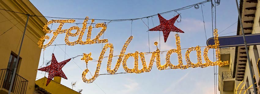 Feliz Navidad Lights over a street in Mexico