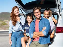 family in back of car